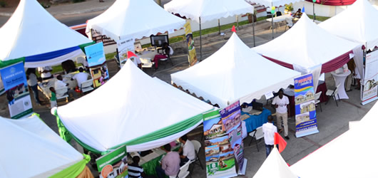 An image of a village fayre with Otaten event marquees